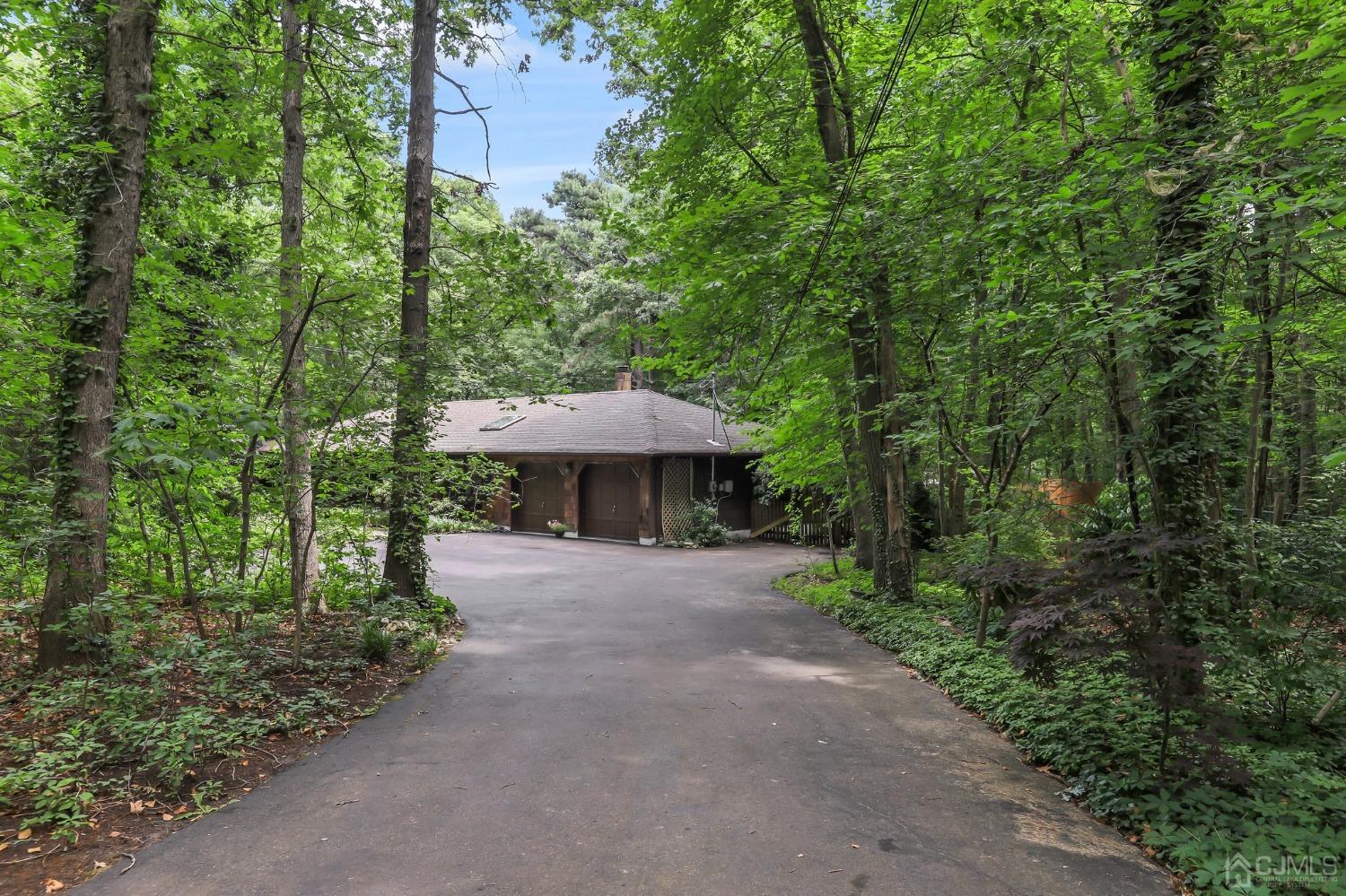 111 Old Forge Road Monroe Township, NJ 08831 - Photo 37 of 39 a view of a street with a bench and trees