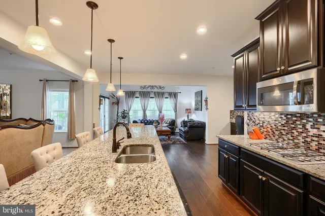 a bathroom with a sink toilet and mirror