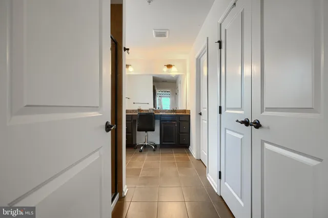 a view of a livingroom with furniture and a flat screen tv