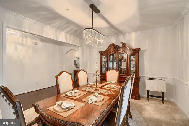 a kitchen with stainless steel appliances granite countertop a sink a stove and a wooden floors