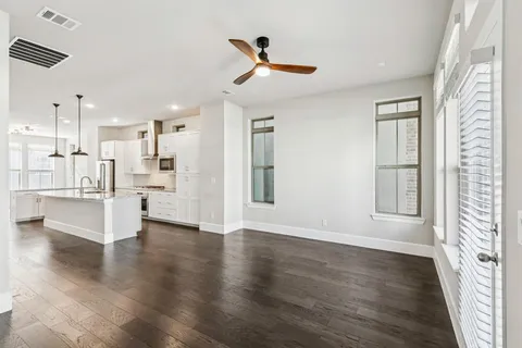 a view of kitchen with furniture and wooden floor