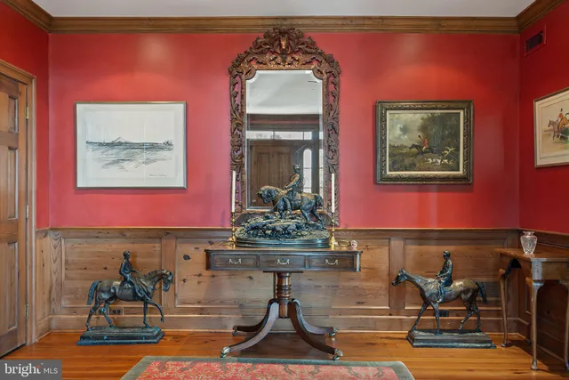 a living room with furniture a rug and a flat screen tv