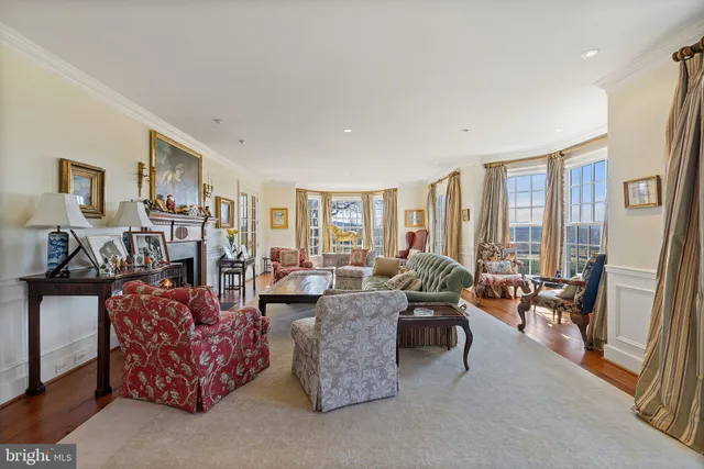 a white bath tub sitting in a bathroom next to a window