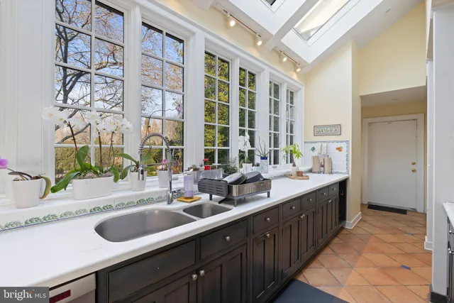 a view of a house with sitting area and garden