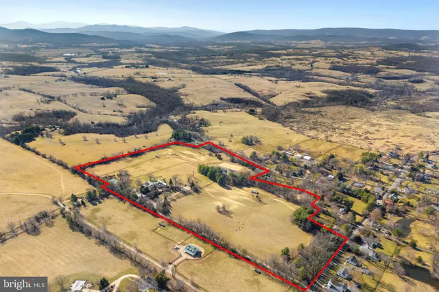 a view of a lake with trees in the background
