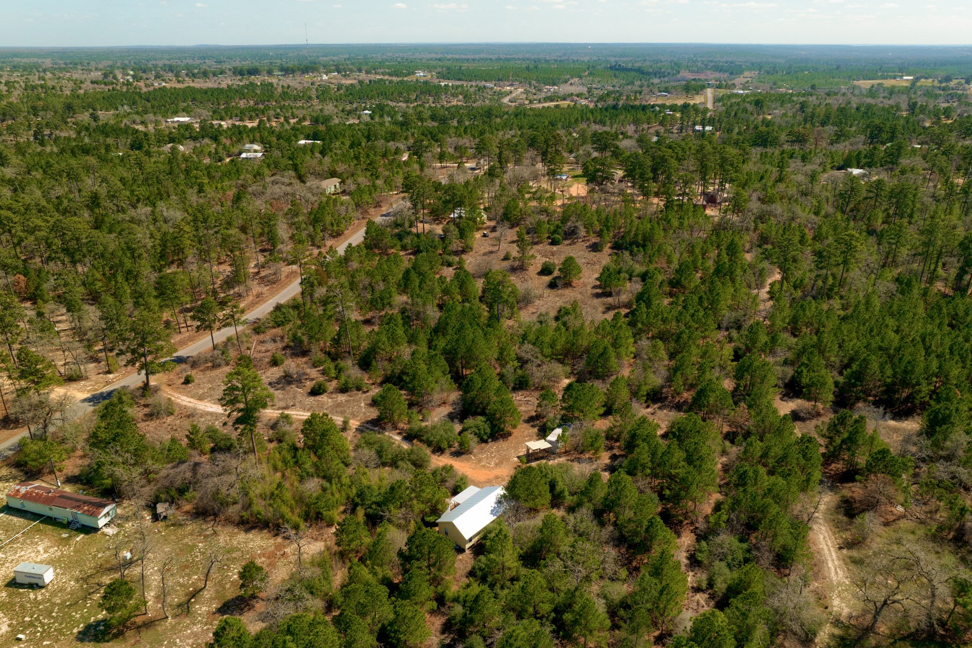 270 Kelley Road West Bastrop, TX 78602 - Photo 26 of 29 a view of a city with lush green forest