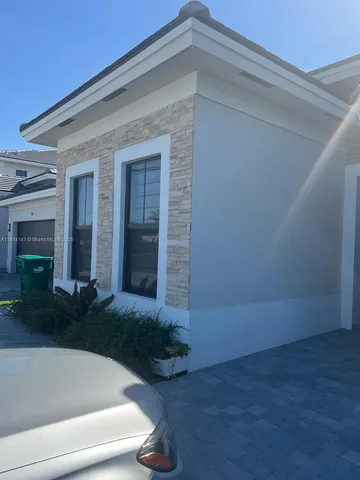 a view of backyard with large tree