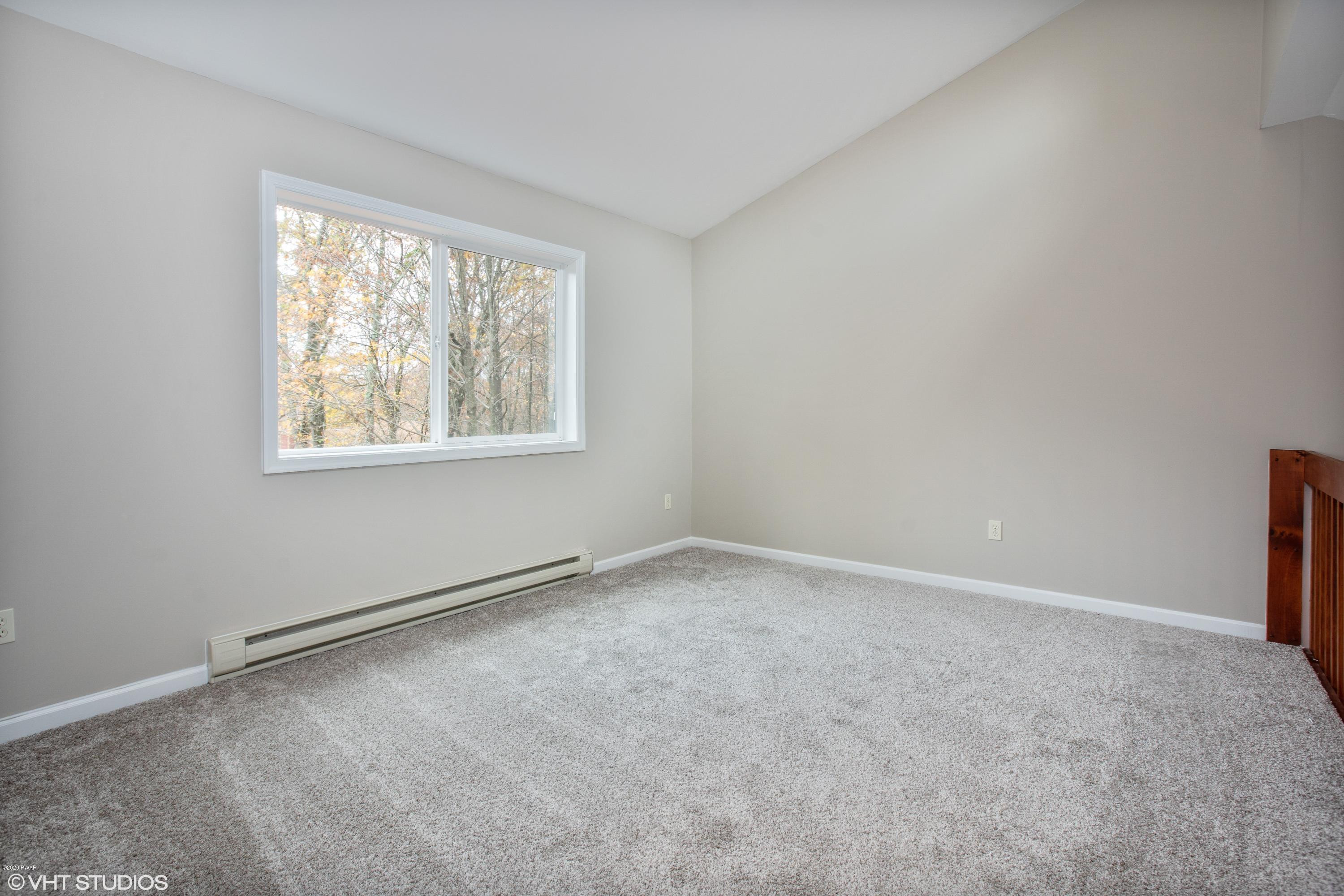 133 Roundhill Road Dingmans Ferry, PA 18328 - Photo 11 of 12 an empty room with a window