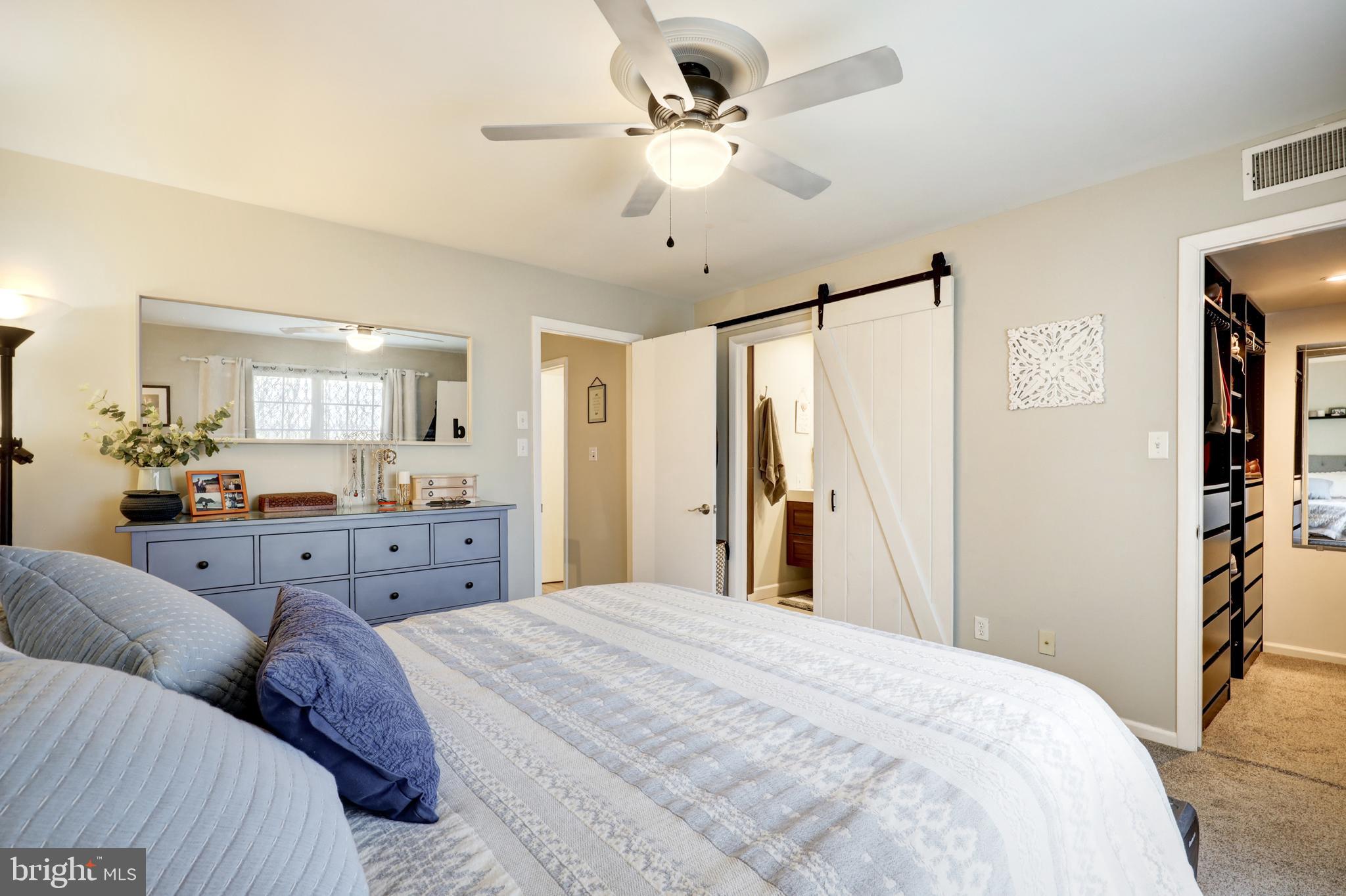 165 Oakmont Court Reading, PA 19607 - Photo 25 of 40 a bedroom with a large bed and ceiling fan