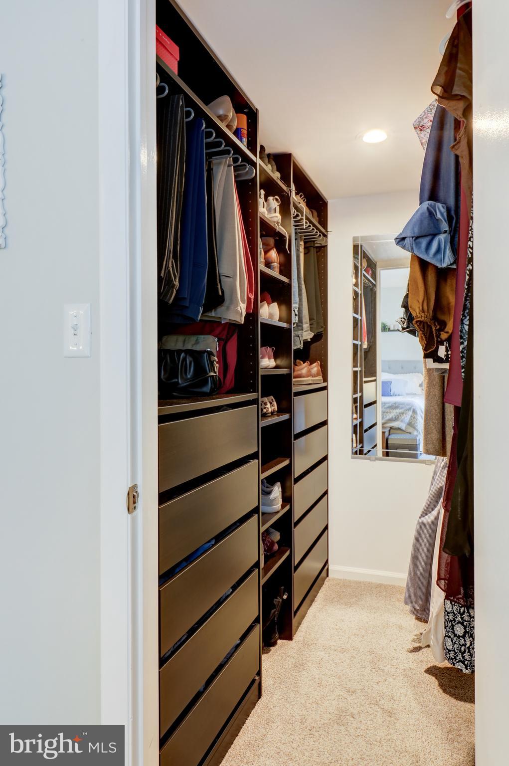 165 Oakmont Court Reading, PA 19607 - Photo 26 of 40 a view of walk in closet with clothes and shoes