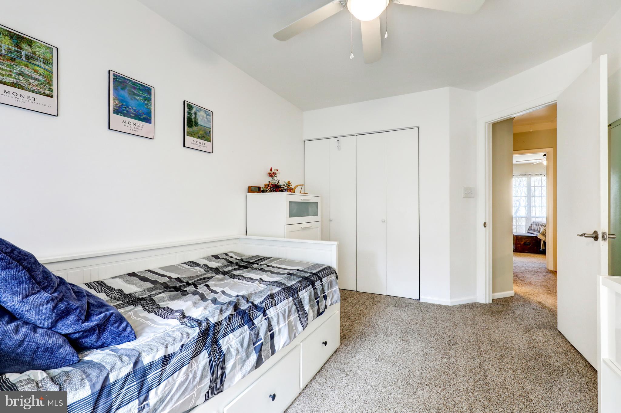 165 Oakmont Court Reading, PA 19607 - Photo 29 of 40 a bedroom with a bed and a chandelier