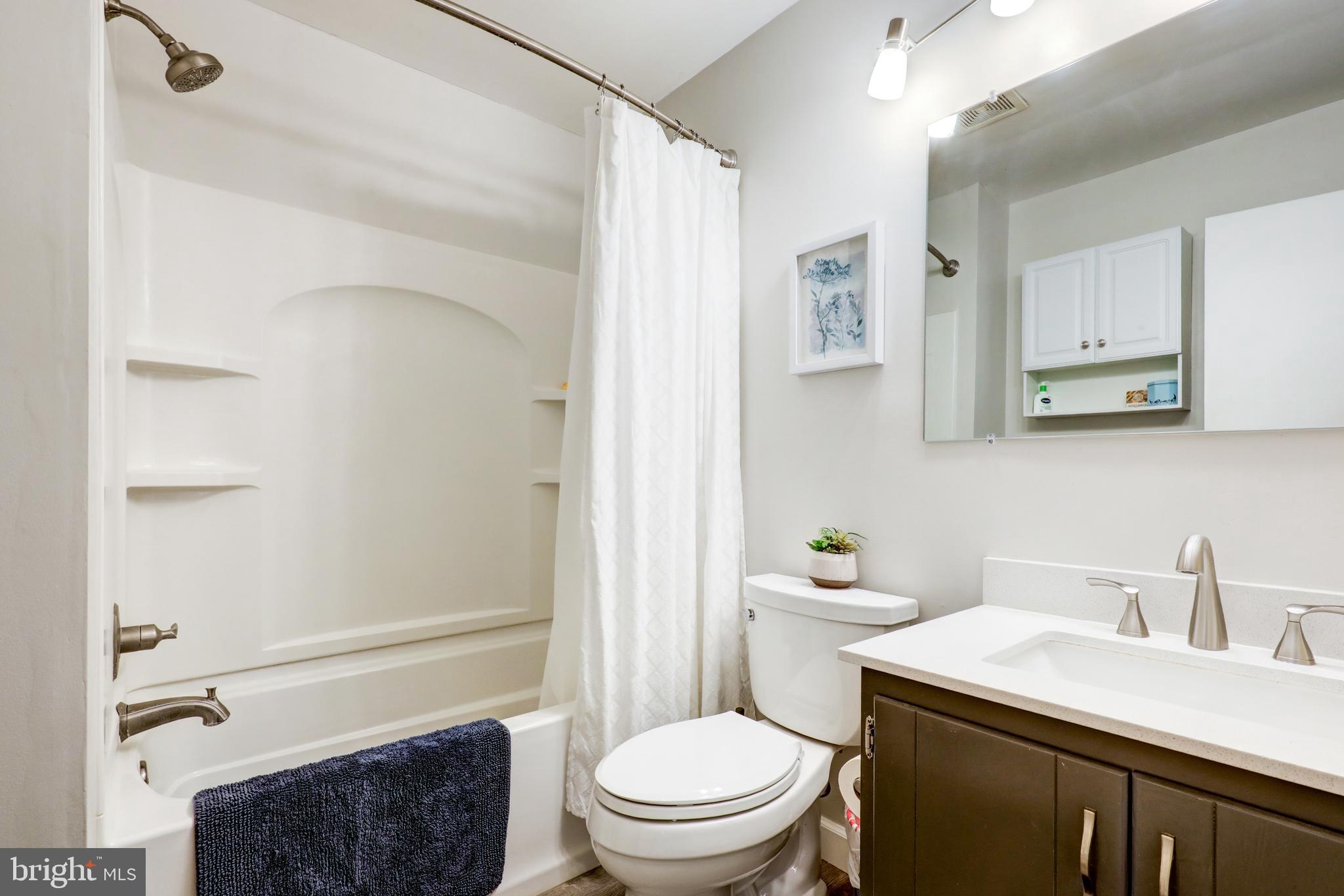 165 Oakmont Court Reading, PA 19607 - Photo 32 of 40 a bathroom with a sink a toilet and shower