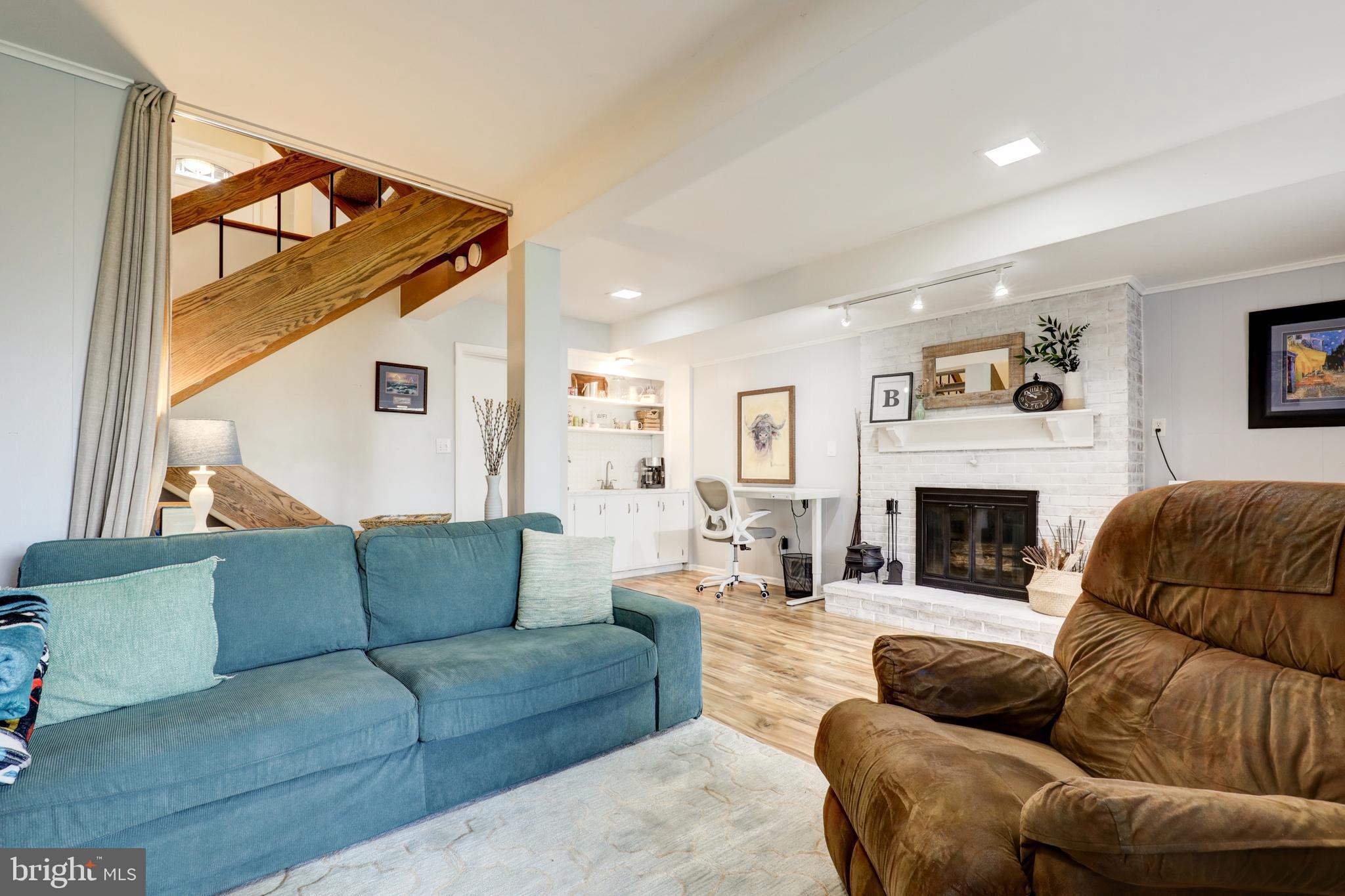165 Oakmont Court Reading, PA 19607 - Photo 34 of 40 a living room with furniture and a fireplace