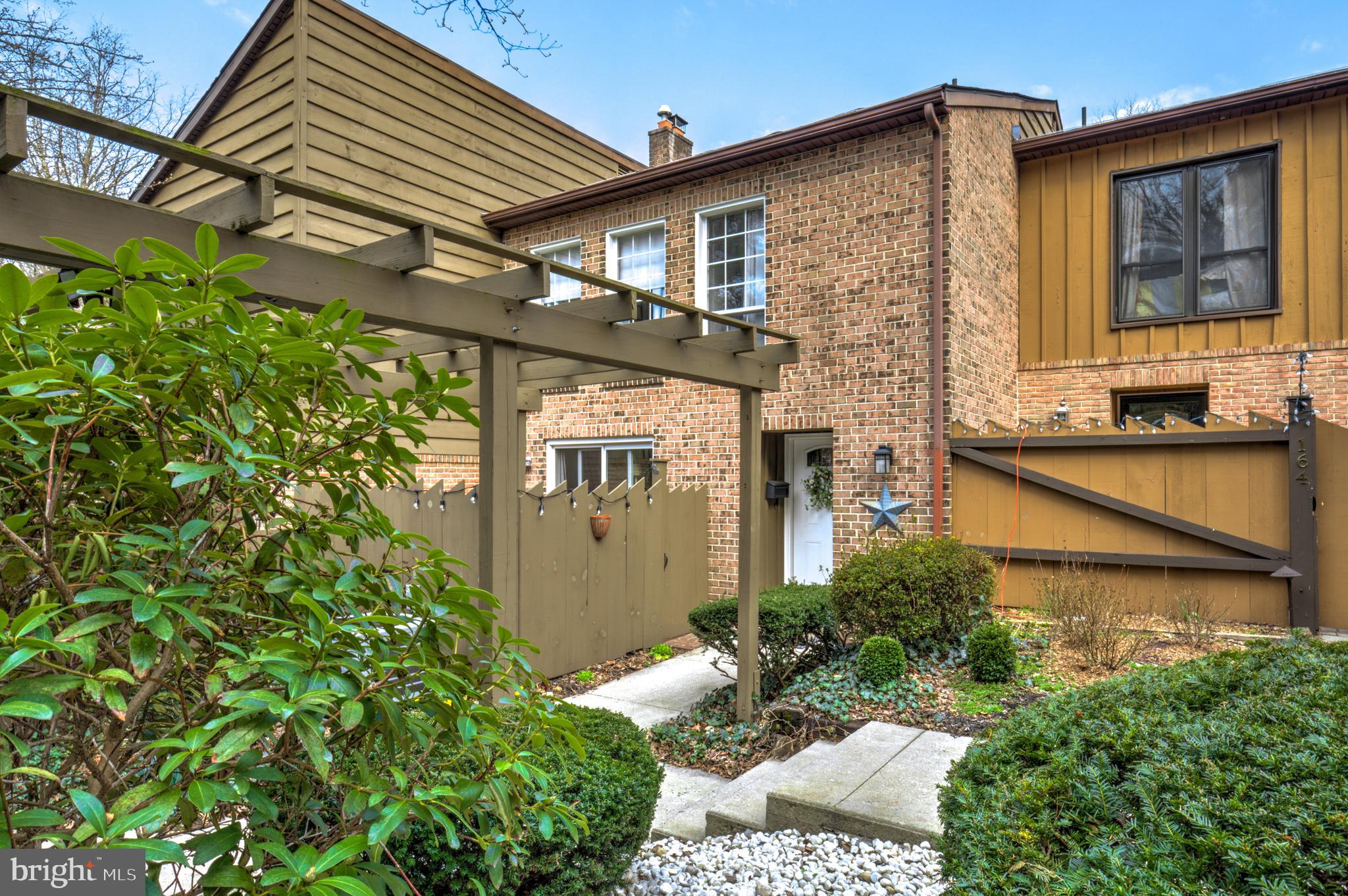 165 Oakmont Court Reading, PA 19607 - Photo 4 of 40 a front view of a house with garden