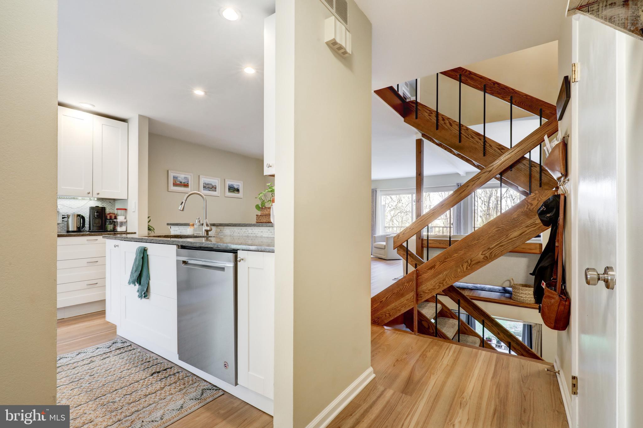 165 Oakmont Court Reading, PA 19607 - Photo 6 of 40 a open kitchen with white cabinets and stainless steel appliances