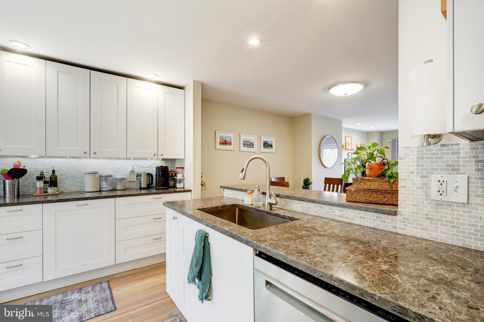 165 Oakmont Court Reading, PA 19607 - Photo 7 of 40 a view of a kitchen with kitchen island a sink stainless steel appliances and cabinets
