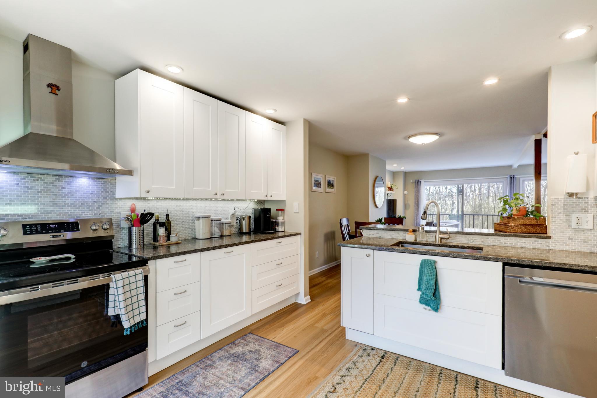 165 Oakmont Court Reading, PA 19607 - Photo 9 of 40 a kitchen with stainless steel appliances kitchen island granite countertop a sink and cabinets