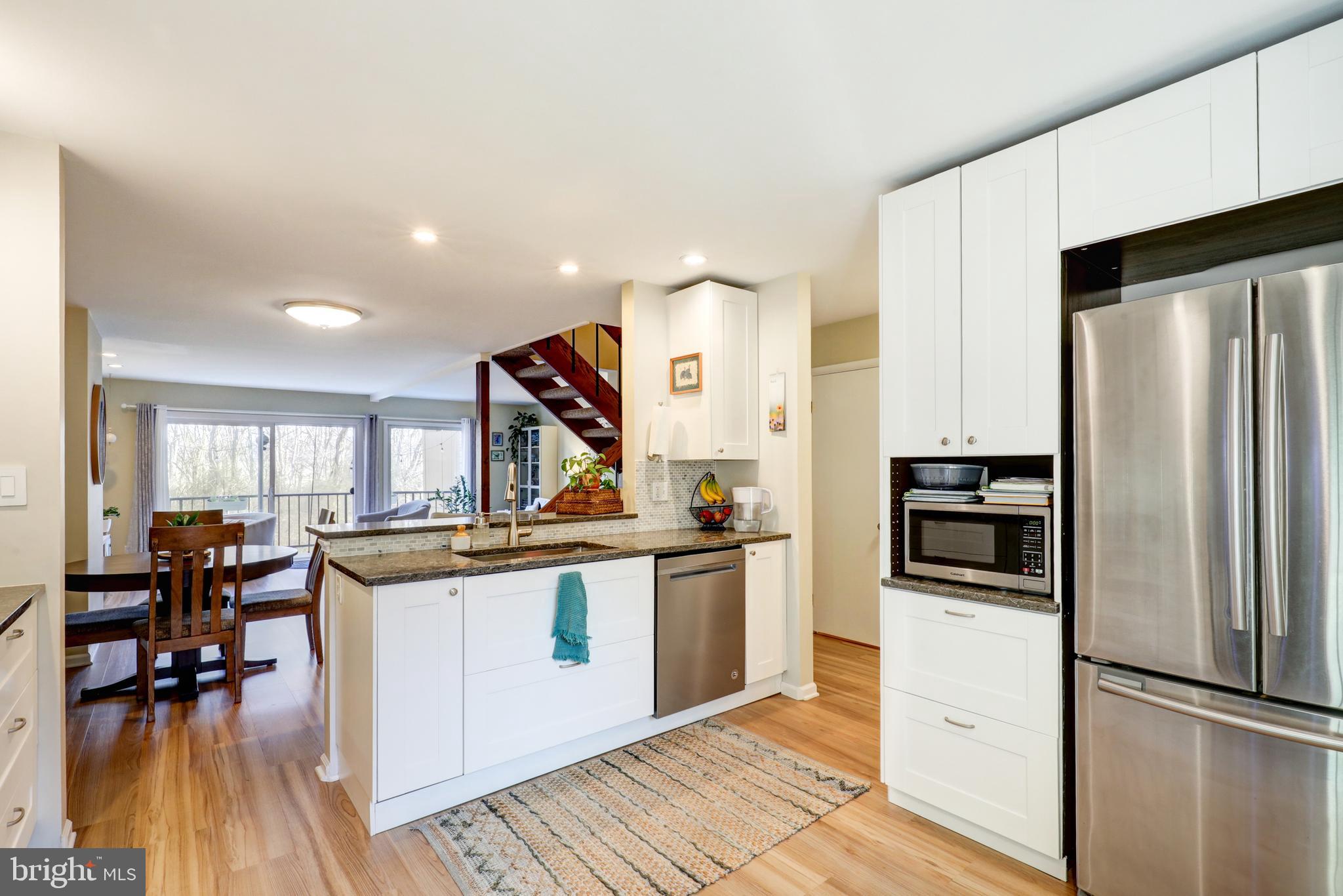 165 Oakmont Court Reading, PA 19607 - Photo 10 of 40 a kitchen with stainless steel appliances granite countertop a refrigerator and a stove top oven