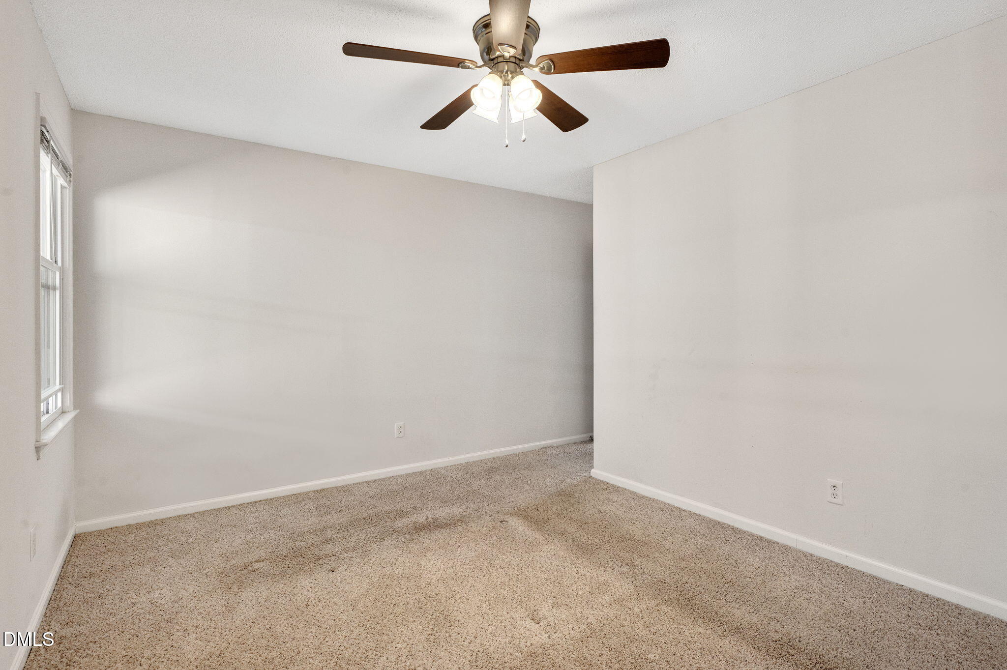 102 Castill Place Garner, NC 27529 - Photo 19 of 37 an empty room with chandelier fan