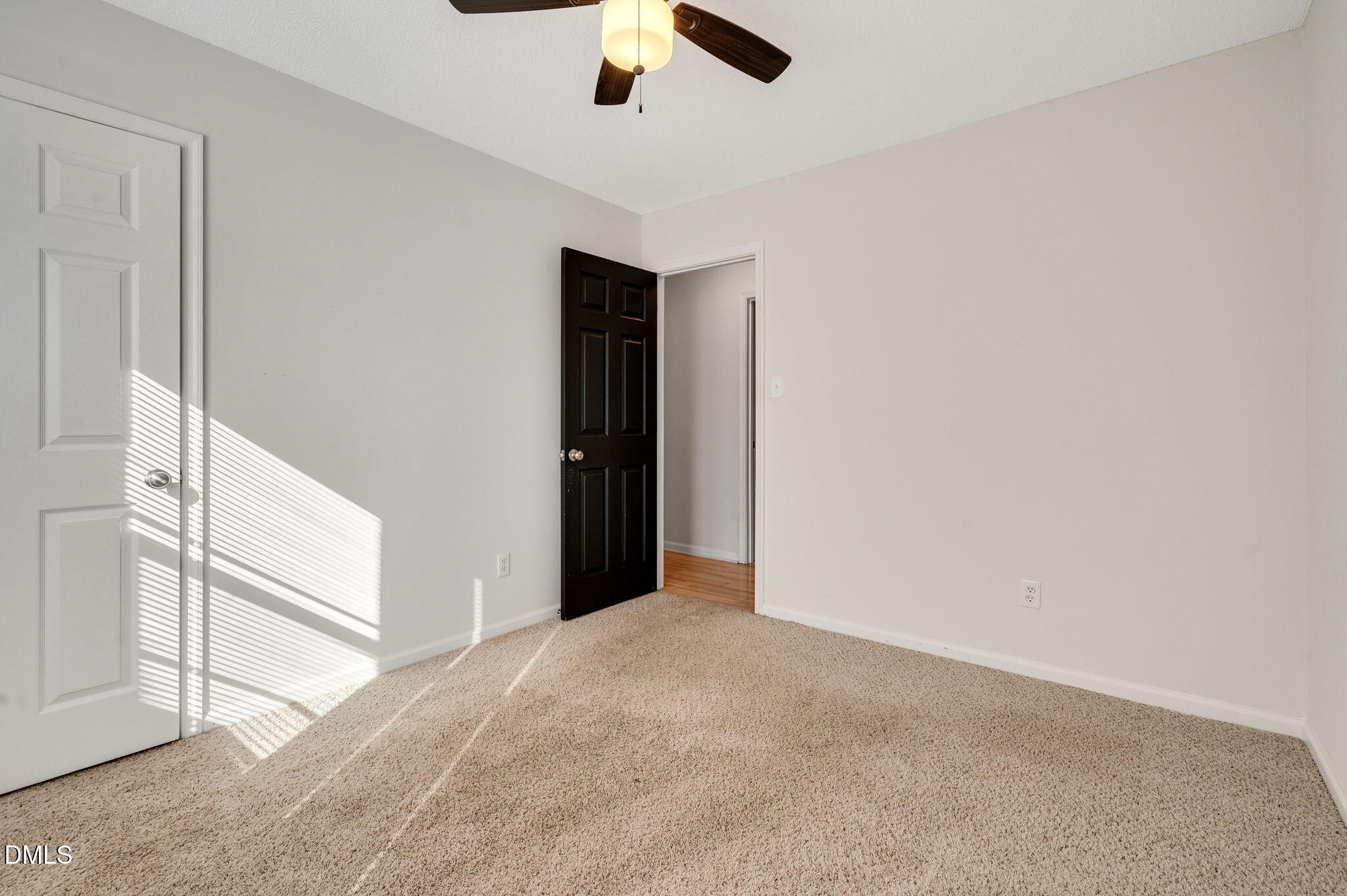 102 Castill Place Garner, NC 27529 - Photo 20 of 37 an empty room with ceiling fan and window