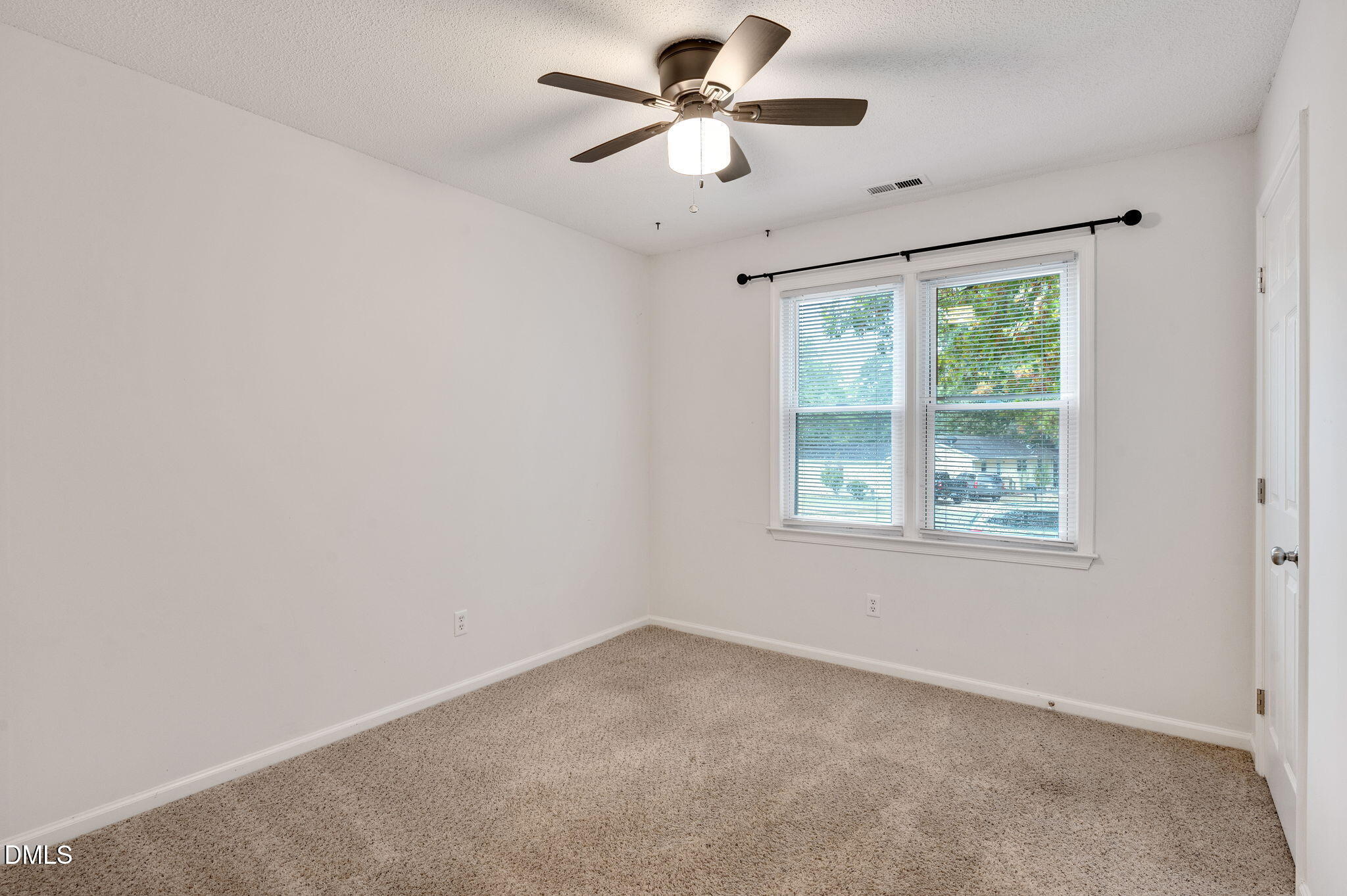 102 Castill Place Garner, NC 27529 - Photo 23 of 37 a view of an empty room with a window