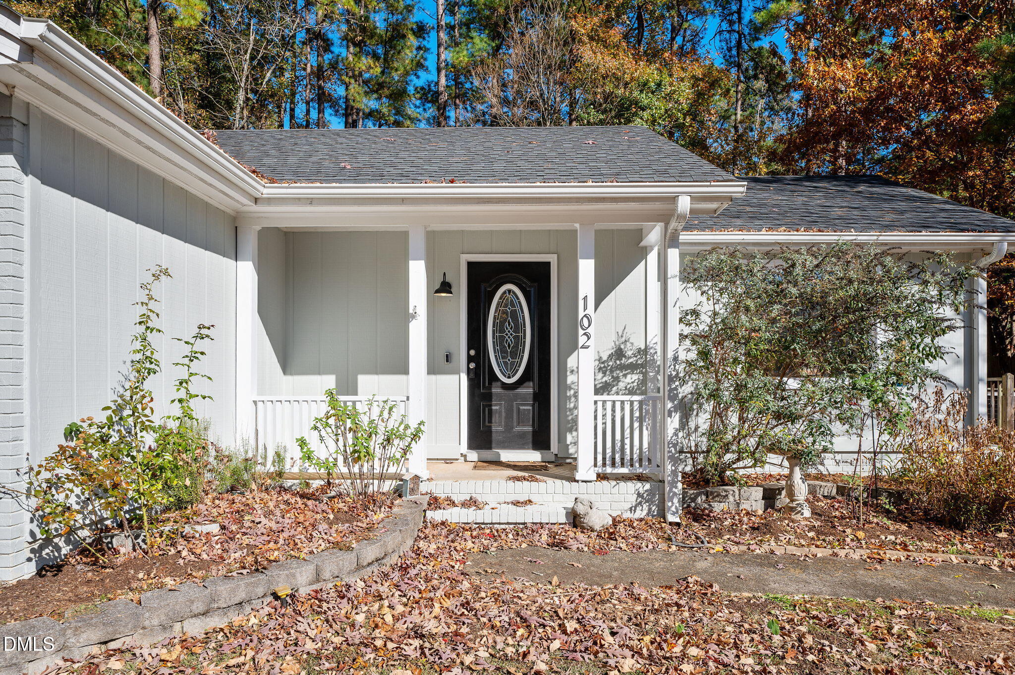 102 Castill Place Garner, NC 27529 - Photo 2 of 37 a front view of a house with garden