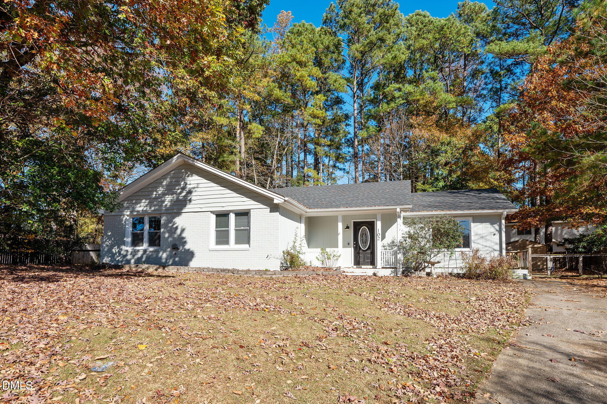102 Castill Place Garner, NC 27529 - Photo 32 of 37 a front view of a house with a yard covered with snow