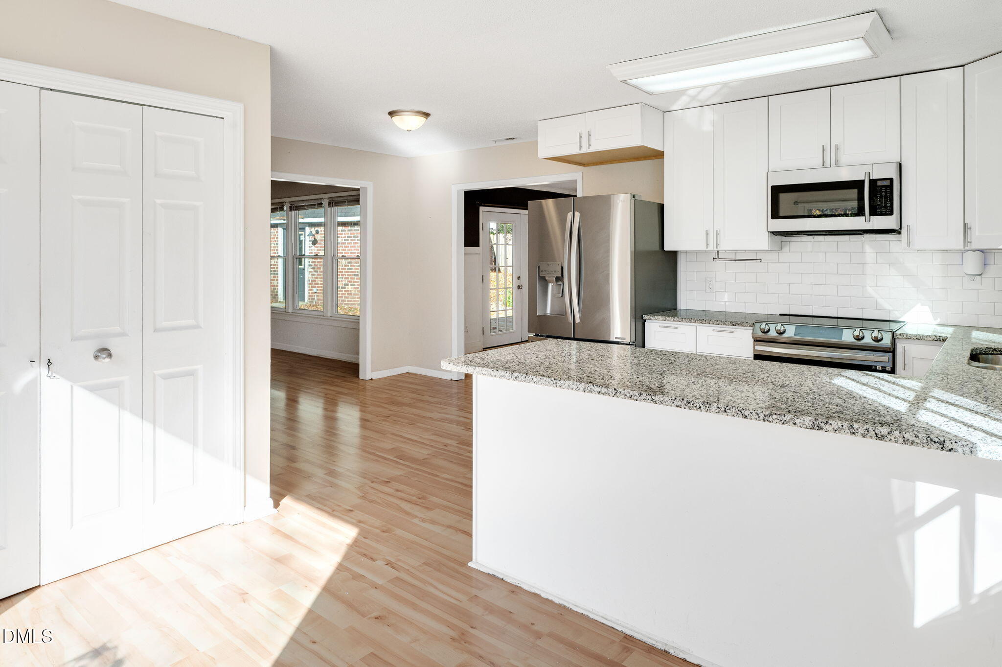 102 Castill Place Garner, NC 27529 - Photo 8 of 37 a kitchen with stainless steel appliances granite countertop a refrigerator a stove top oven a sink and dishwasher