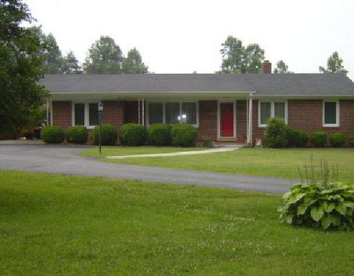 10744 Henry Road Henry, VA 24102 - Photo 1 of 1 a front view of house with yard and green space