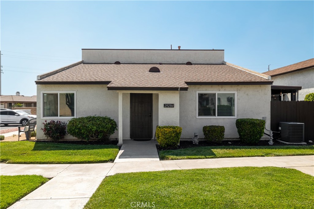 29254 Murrieta Road Menifee, CA 92586 - Photo 1 of 1 a front view of a house with a yard