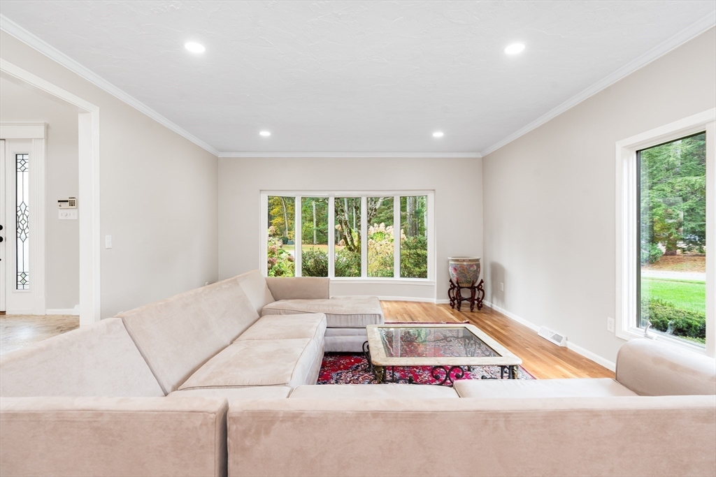 7 Saddle Ridge Road Sudbury, MA 01776 - Photo 14 of 42 a living room with furniture and floor to ceiling windows