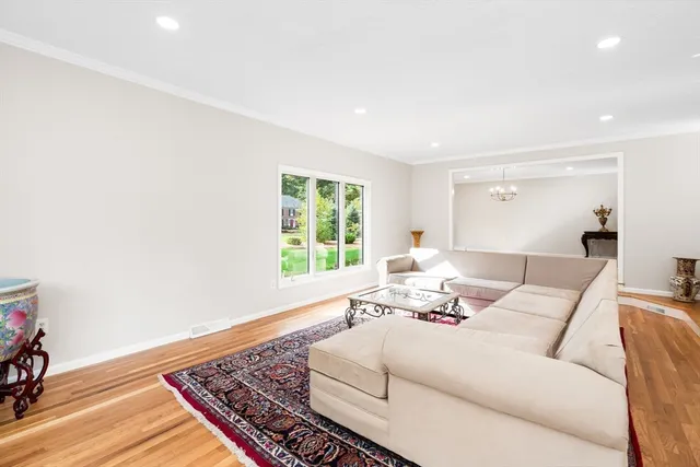 a living room with furniture and a rug