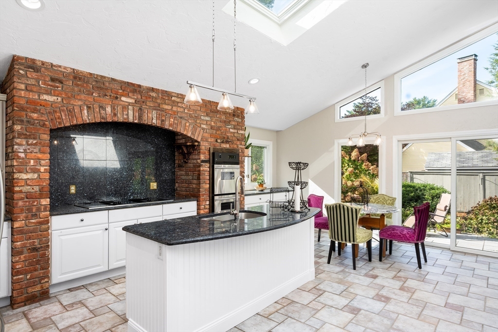 7 Saddle Ridge Road Sudbury, MA 01776 - Photo 20 of 42 a kitchen with granite countertop a sink and a stove