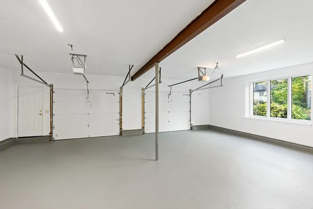 a view of a livingroom with an empty space and a window