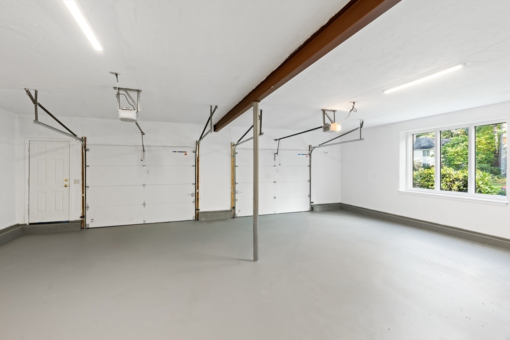 7 Saddle Ridge Road Sudbury, MA 01776 - Photo 39 of 42 a view of a livingroom with an empty space and a window