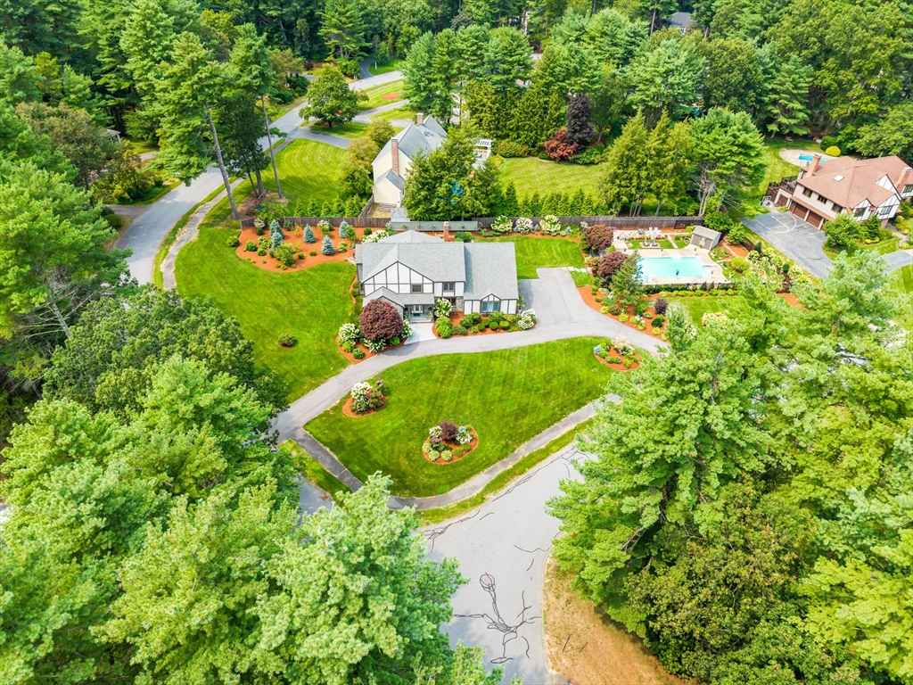 7 Saddle Ridge Road Sudbury, MA 01776 - Photo 7 of 42 an aerial view of a house with a garden and swimming pool