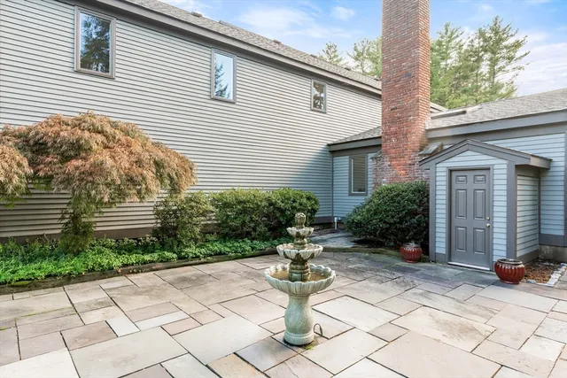 a view of a house with sitting area and a yard