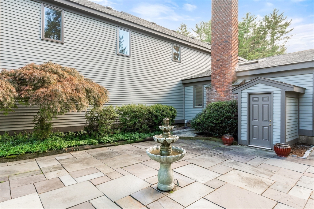 7 Saddle Ridge Road Sudbury, MA 01776 - Photo 10 of 42 a view of a house with sitting area and a yard