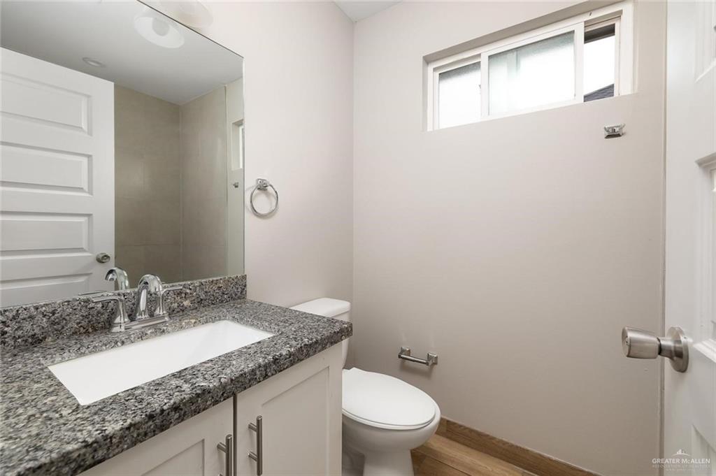 826 South Missouri Street, Unit C Alton, TX 78573 - Photo 9 of 9 Bathroom with plenty of natural light, vanity, and light wood-type flooring