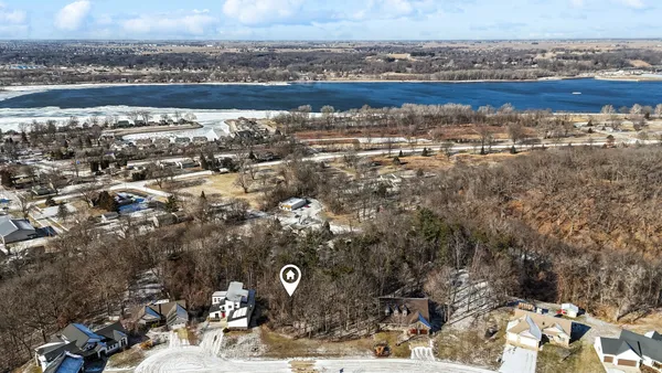 a aerial view of a house with a yard
