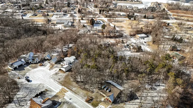 a view of outdoor space with green field and trees