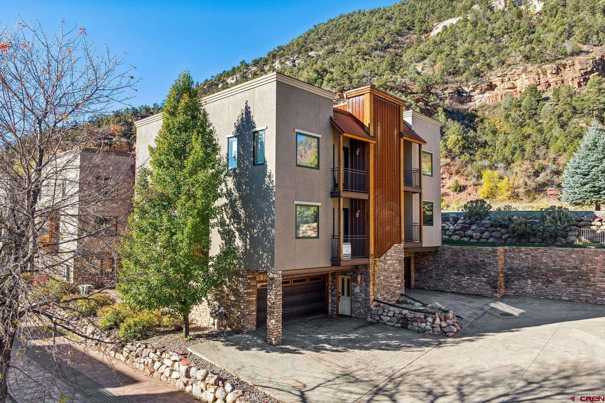 1422 Animas View Drive, Unit 55 Durango, CO 81301 - Photo 1 of 44 a front view of a house with garden