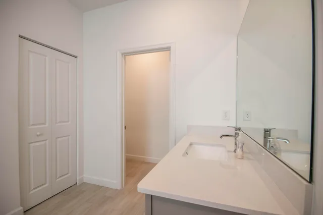 a utility room with a sink dryer and washer