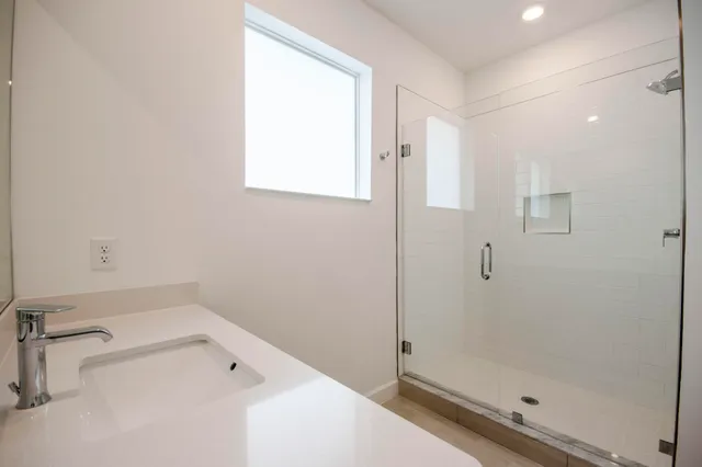a bathroom with a bathtub and a shower