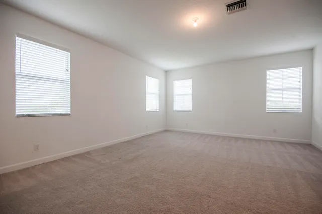 a white toilet sitting next to a white sink