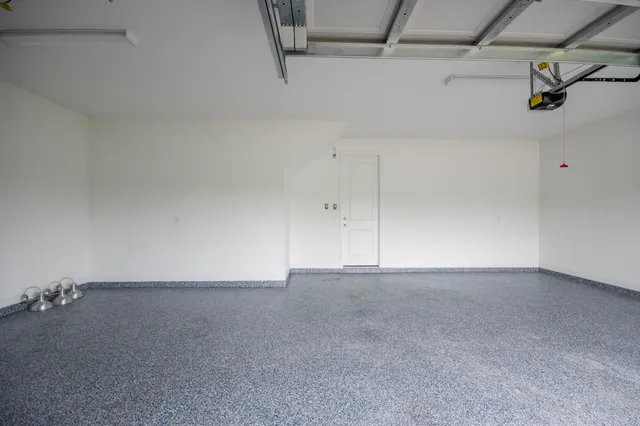 an aerial view of a house with a lake view