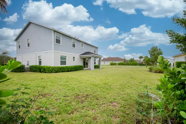 a view of a swimming pool with an outdoor space and seating area