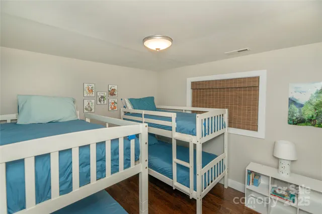 a bedroom with furniture and a window