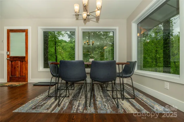 a view of a dining room with furniture window and outside view