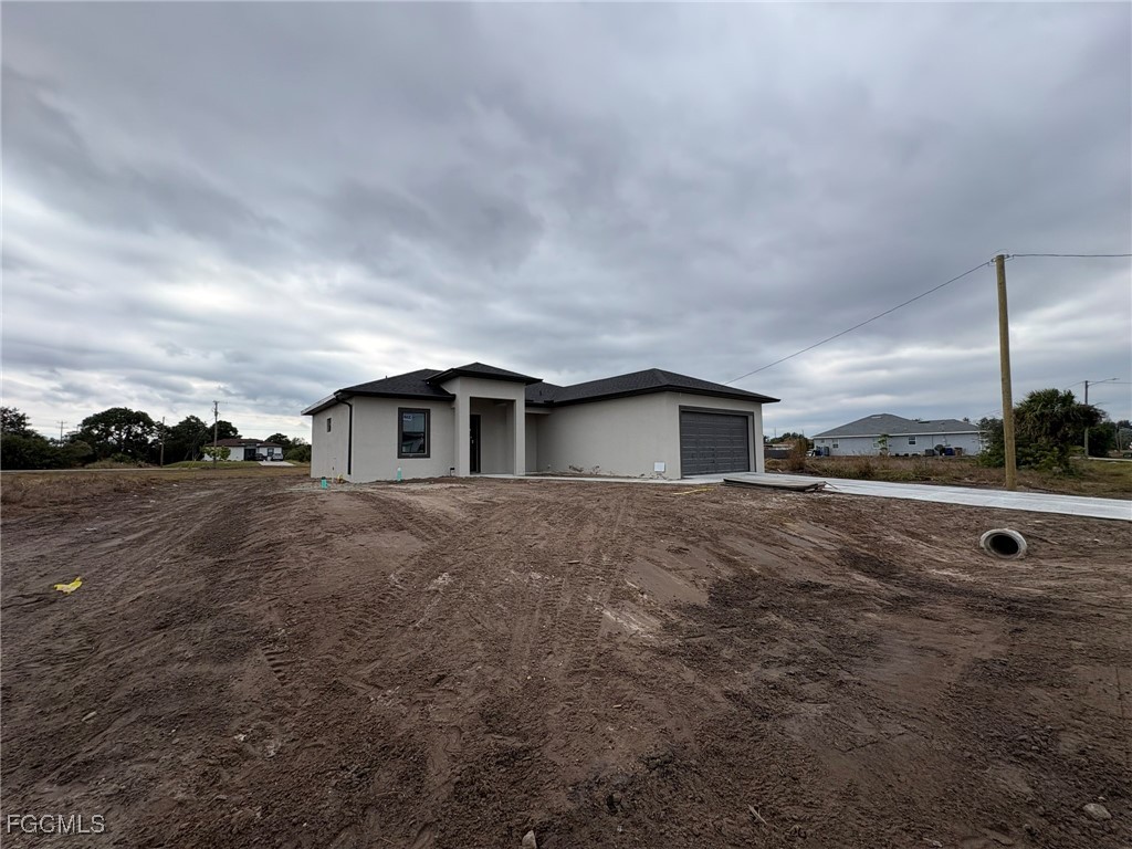 2503 45th Street Southwest Lehigh Acres, FL 33976 - Photo 2 of 7 a view of a house with a yard